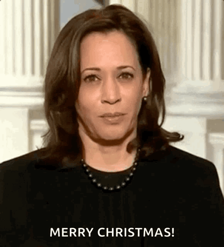 A Close Up Of A Woman 'S Face With The Words `` Merry Christmas '' Written On It . GIF