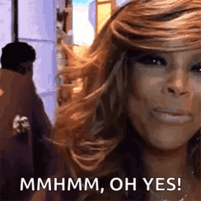 A Close Up Of A Woman 'S Face With The Words `` Mhmm , Oh Yes '' Written On It . GIF
