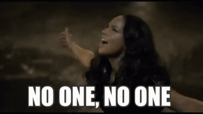 A Close Up Of A Woman 'S Face With The Words `` No One , No One '' . GIF
