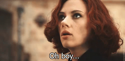 A Close Up Of A Woman 'S Face With The Words Oh Boy Written On It . GIF