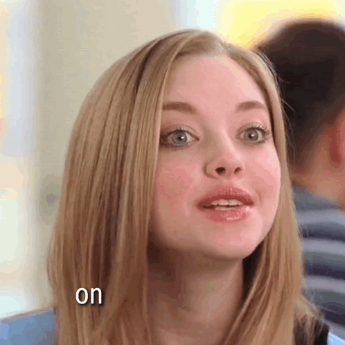 A Close Up Of A Woman 'S Face With The Words " On " Below Her GIF