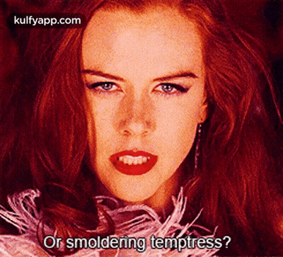A Close Up Of A Woman 'S Face With The Words " Or Smoldering Temptress ? " GIF