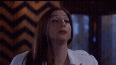 A Close Up Of A Woman 'S Face With The Words Pamplemousse Lacroix Below Her GIF