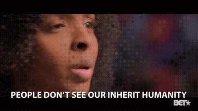 A Close Up Of A Woman 'S Face With The Words People Do N't See Our Inherit Humanity Below Her GIF