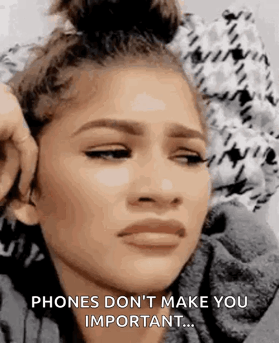 A Close Up Of A Woman 'S Face With The Words `` Phones Don 'T Make You Important '' . GIF