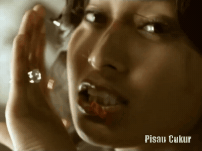 A Close Up Of A Woman 'S Face With The Words Pisau Ukur Below It GIF