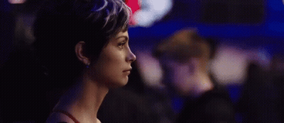 A Close Up Of A Woman 'S Face With The Words Ruh-Roh In Red GIF