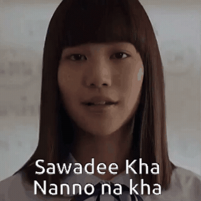 A Close Up Of A Woman 'S Face With The Words Sawadee Kha Nanno Na Kha Written On Her Face . GIF
