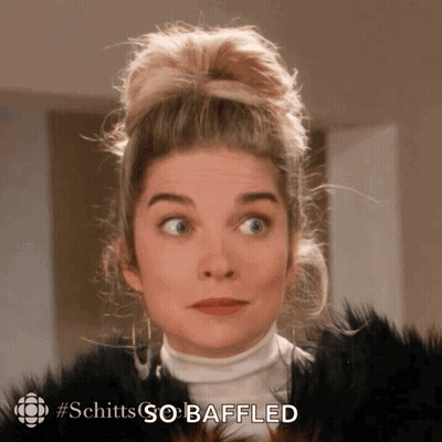 A Close Up Of A Woman 'S Face With The Words Schitts So Bafled Written On The Bottom GIF