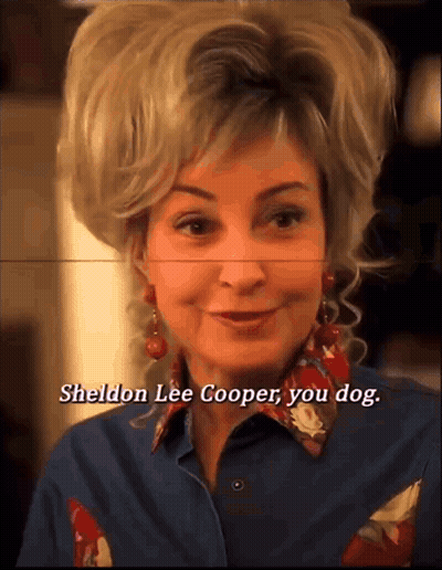 A Close Up Of A Woman 'S Face With The Words Sheldon Lee Cooper You Dog Below Her GIF