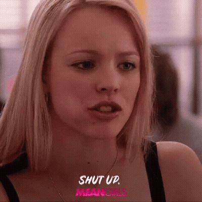 A Close Up Of A Woman 'S Face With The Words `` Shut Up Mean Girls '' Written On The Bottom . GIF
