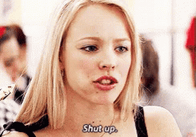 A Close Up Of A Woman 'S Face With The Words `` Shut Up '' Written On Her Neck . GIF