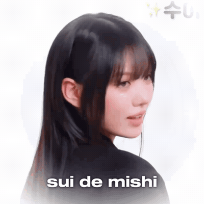 A Close Up Of A Woman 'S Face With The Words Sui De Mishi In The Corner GIF