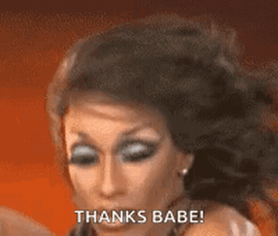 A Close Up Of A Woman 'S Face With The Words `` Thanks Babe '' Written On Her Face . GIF