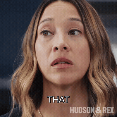 A Close Up Of A Woman 'S Face With The Words That Hudson & Rex Above Her GIF