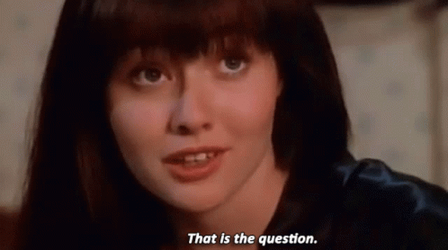 A Close Up Of A Woman 'S Face With The Words That Is The Question Below Her GIF