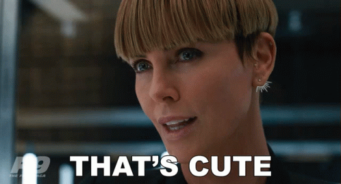 A Close Up Of A Woman 'S Face With The Words That 'S Cute Behind Her GIF