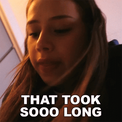 A Close Up Of A Woman 'S Face With The Words That Took Sooo Long Behind Her GIF