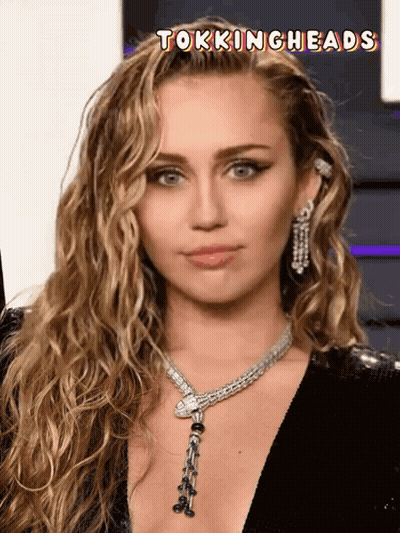 A Close Up Of A Woman 'S Face With The Words Tockingheads Above It GIF