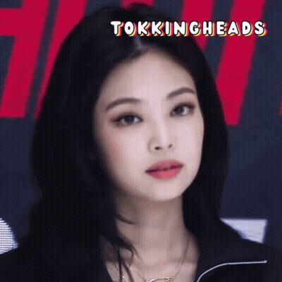A Close Up Of A Woman 'S Face With The Words " Tokingheads " Above Her GIF