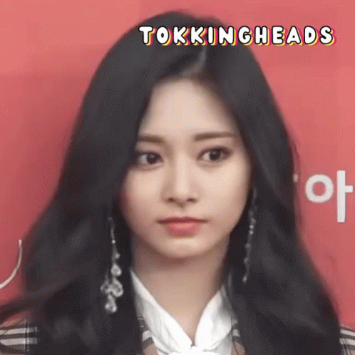 A Close Up Of A Woman 'S Face With The Words " Tokingheads " Above Her GIF