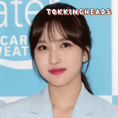 A Close Up Of A Woman 'S Face With The Words Tokingheads Written Above Her GIF