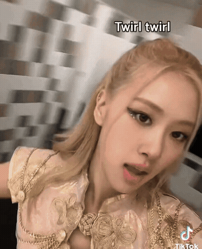 A Close Up Of A Woman 'S Face With The Words Twirl Twirl Below Her GIF