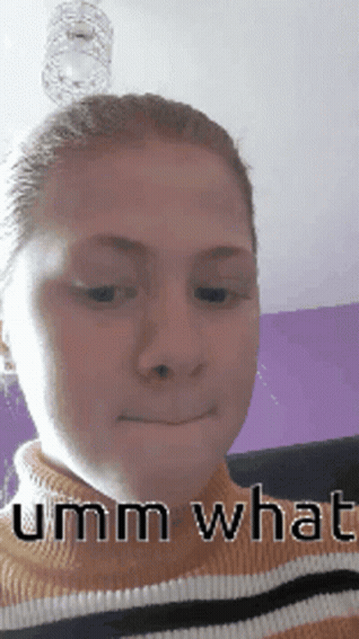 A Close Up Of A Woman 'S Face With The Words Umm What On It GIF