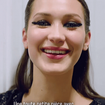 A Close Up Of A Woman 'S Face With The Words " Une Toute Petite Piece Avec " Below Her GIF
