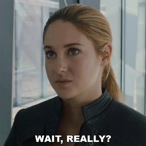 A Close Up Of A Woman 'S Face With The Words Wait Really Below It GIF