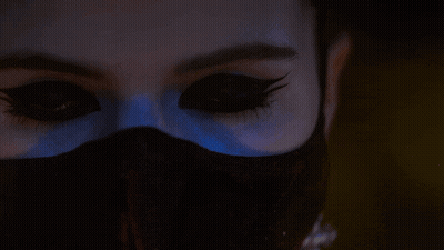 A Close Up Of A Woman 'S Face With The Words Watches You Burn GIF