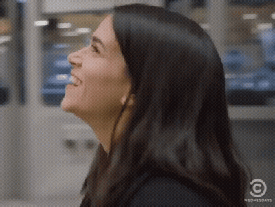 A Close Up Of A Woman 'S Face With The Words Wednesdays On The Bottom GIF