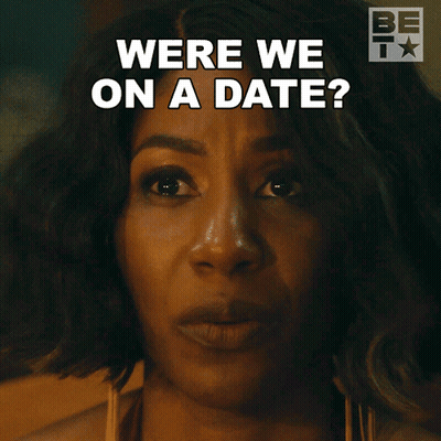 A Close Up Of A Woman 'S Face With The Words Were We On A Date Above Her GIF
