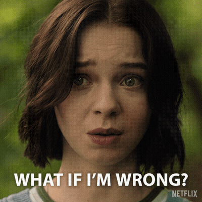 A Close Up Of A Woman 'S Face With The Words " What If I 'M Wrong " Above Her GIF