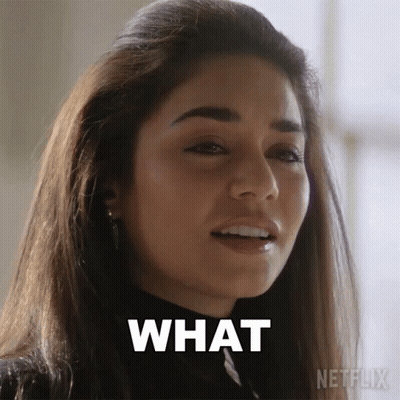 A Close Up Of A Woman 'S Face With The Words What Written On Her Face GIF