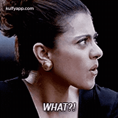 A Close Up Of A Woman 'S Face With The Words `` What '' Written On It . GIF