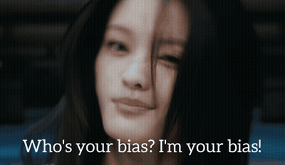 A Close Up Of A Woman 'S Face With The Words Who 'S Your Bias I 'M Your Bias Below Her GIF