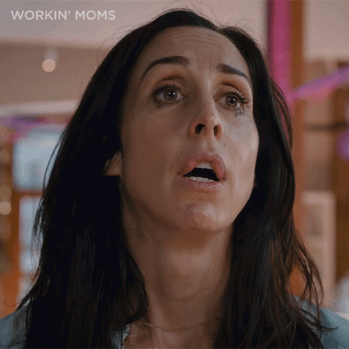 A Close Up Of A Woman 'S Face With The Words Workin ' Moms On The Bottom GIF