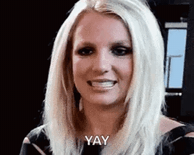 A Close Up Of A Woman 'S Face With The Words `` Yay '' Written On It . GIF
