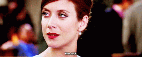 Close Up Of Woman's Face With You Suck Text GIF