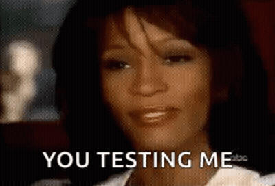 A Close Up Of A Woman 'S Face With The Words `` You Testing Me '' On It . GIF