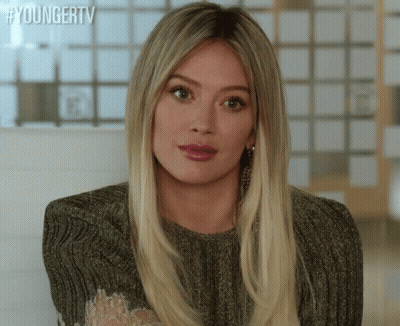 A Close Up Of A Woman 'S Face With The Words Youngertv Written On The Bottom GIF