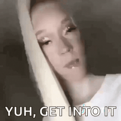 A Close Up Of A Woman 'S Face With The Words `` Yuh , Get Into It '' Written On The Bottom . GIF