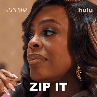 A Close Up Of A Woman 'S Face With The Words Zip It GIF