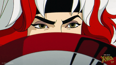 A Close Up Of A Woman 'S Face With Xmen Written On The Bottom Right GIF