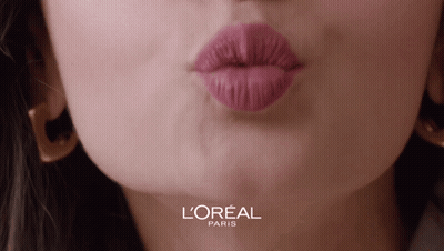A Close Up Of A Woman 'S Lips With A L' Oreal Paris Logo Behind Her GIF