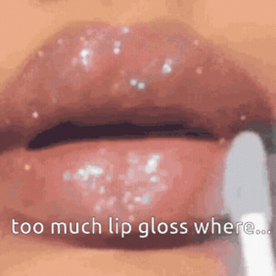 A Close Up Of A Woman 'S Lips With Lip Gloss Being Applied . GIF