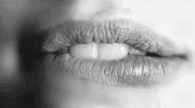 A Close Up Of A Woman 'S Lips With Lipstick On Them . GIF