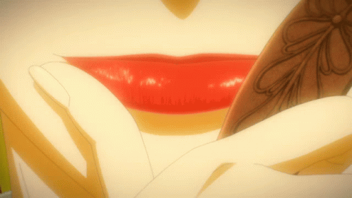 A Close Up Of A Woman 'S Lips With Red Lipstick And A Flower Design GIF