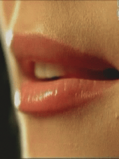 A Close Up Of A Woman 'S Lips With Red Lipstick On GIF